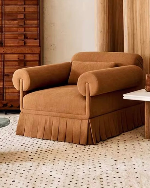 The Capri Chair blends nostalgic elegance with everyday comfort. Featuring rolled arms, plush cushioning, and a beautifully tailored pleated skirt, it adds a touch of classic sophistication to any space. Designed for lounging, reading, or conversation, the Capri Chair is as inviting as it is stylish.