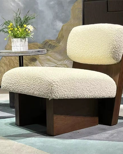 The Haven Chair is designed as a sanctuary of comfort and style. With its plush, cloud-like cushions and bold wooden base, this luxury lounge chair strikes the perfect balance between softness and structure. Its low, grounded silhouette makes it a statement piece for modern living rooms, bedrooms, or reading corners, while offering unparalleled comfort.