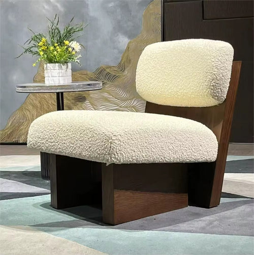 The Haven Chair is designed as a sanctuary of comfort and style. With its plush, cloud-like cushions and bold wooden base, this luxury lounge chair strikes the perfect balance between softness and structure. Its low, grounded silhouette makes it a statement piece for modern living rooms, bedrooms, or reading corners, while offering unparalleled comfort.