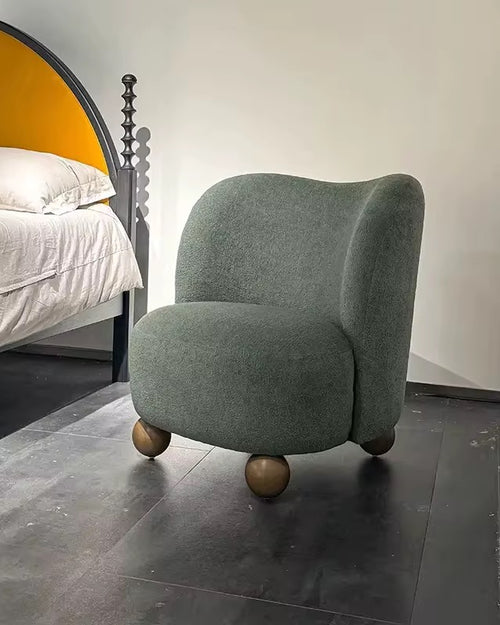 The Miro Chair is where creativity meets comfort, bringing an artistic yet cozy touch to modern interiors. With its plush upholstery and rounded silhouette supported by unique spherical wooden legs, this chair offers both softness and sculptural beauty. Its distinctive design makes it a perfect accent for bedrooms, lounges, or reading corners, adding a playful yet refined statement to your space.