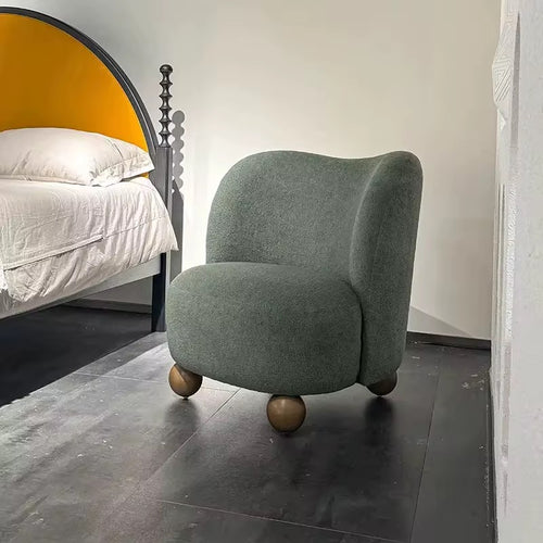 The Miro Chair is where creativity meets comfort, bringing an artistic yet cozy touch to modern interiors. With its plush upholstery and rounded silhouette supported by unique spherical wooden legs, this chair offers both softness and sculptural beauty. Its distinctive design makes it a perfect accent for bedrooms, lounges, or reading corners, adding a playful yet refined statement to your space.