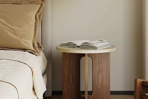 The Hikari Side Table brings a sense of gentle radiance and natural warmth to your living space. Crafted from premium wood with a smooth, round tabletop and a thoughtfully designed base, it reflects the timeless beauty of simplicity. Inspired by Japandi and Wabi-Sabi aesthetics, the Hikari Side Table celebrates understated elegance, organic textures, and harmonious proportions, making it a perfect companion for serene bedrooms, cozy living areas, or mindful reading nooks.