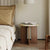 The Hikari Side Table brings a sense of gentle radiance and natural warmth to your living space. Crafted from premium wood with a smooth, round tabletop and a thoughtfully designed base, it reflects the timeless beauty of simplicity. Inspired by Japandi and Wabi-Sabi aesthetics, the Hikari Side Table celebrates understated elegance, organic textures, and harmonious proportions, making it a perfect companion for serene bedrooms, cozy living areas, or mindful reading nooks.