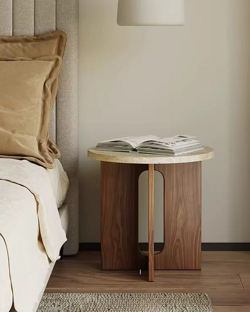 The Hikari Side Table brings a sense of gentle radiance and natural warmth to your living space. Crafted from premium wood with a smooth, round tabletop and a thoughtfully designed base, it reflects the timeless beauty of simplicity. Inspired by Japandi and Wabi-Sabi aesthetics, the Hikari Side Table celebrates understated elegance, organic textures, and harmonious proportions, making it a perfect companion for serene bedrooms, cozy living areas, or mindful reading nooks.