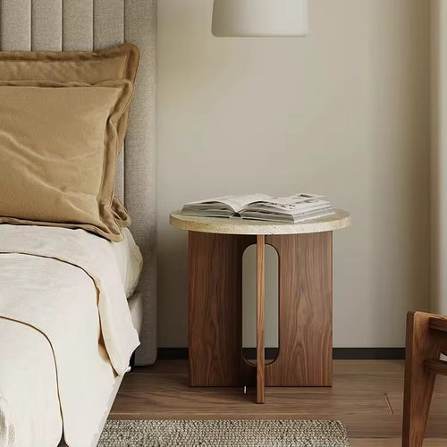 The Hikari Side Table brings a sense of gentle radiance and natural warmth to your living space. Crafted from premium wood with a smooth, round tabletop and a thoughtfully designed base, it reflects the timeless beauty of simplicity. Inspired by Japandi and Wabi-Sabi aesthetics, the Hikari Side Table celebrates understated elegance, organic textures, and harmonious proportions, making it a perfect companion for serene bedrooms, cozy living areas, or mindful reading nooks.
