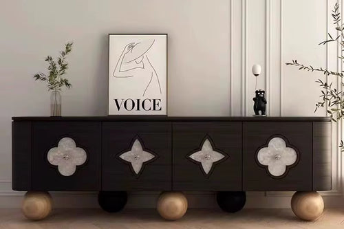 Clayton Console – Luxury Console Furniture Online in India
The Clayton Console by Chair Collective is a true luxury masterpiece for modern interiors. Designed in a perfected dark veneer structure, it features luminous Selenite marble inlays that create a glowing contrast, while its sculptural Teak wood ball legs add an artistic foundation. At 7 feet in length (approx. 20 in depth × 30 in height), this designer console exudes presence and refinement, making it a statement piece for sophisticated homes.
