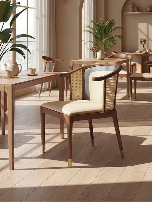 Discover the Ebaa Chair in teak wood with cane accents and gold-capped legs — a retro modern café chair crafted for luxury interiors in India.