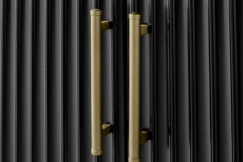 Close-up of vertical brass handles 