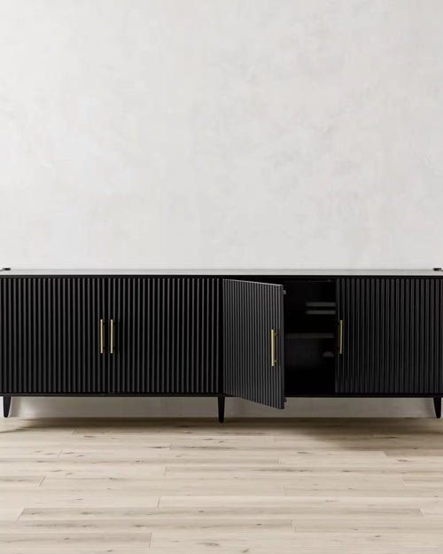 Modern black storage console with golden handles