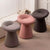 Three textured stools in gray, pink, and brown color