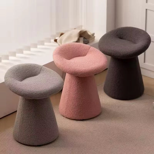 Three textured stools in gray, pink, and brown color