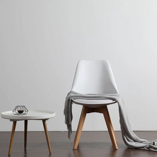 Modern cafe chair with a white plastic top 