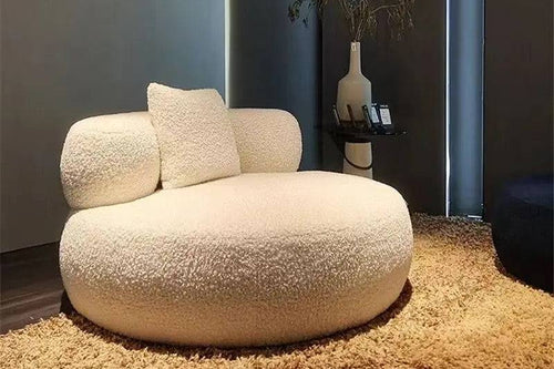 An oversized round chair with a luxurious appearance