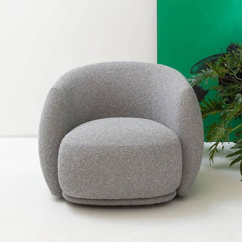 A gray oversized, round bucket chair with plush cushioning