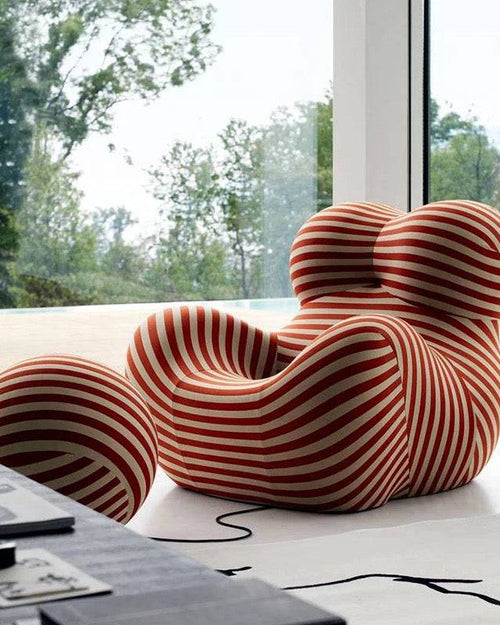 Side profile of Kiki Play Chair, emphasizing its elegant curves 
