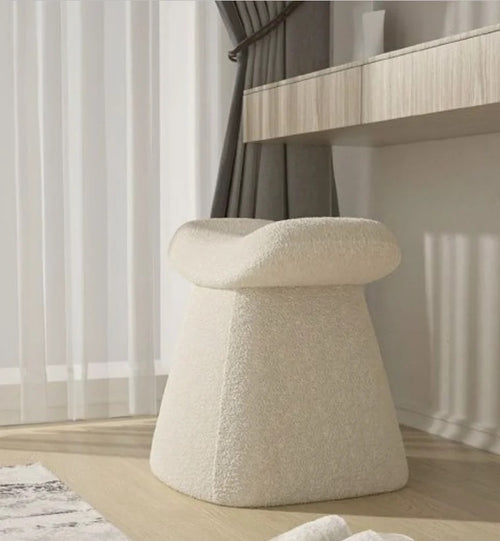 Side angle of arc white pouf 