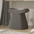 Curved grey pouf for modern interiors