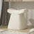 Curved white seat pouf for living room