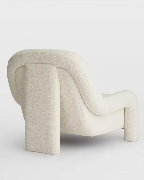 Back view of Ladro chair highlighting its curved design