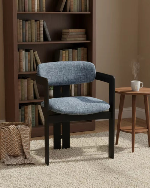 Lazio Dining Chair featuring a structured wooden frame, softly curved upholstered backrest, and cushioned seat, designed for contemporary dining interiors.