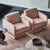 A pair of pink upholstered chairs with a modern design