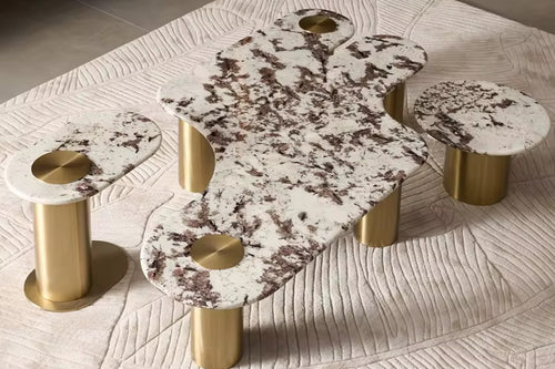 Shop the Luxero Luxury Coffee Table Set featuring an abstract marble top, elliptical and round end tables, and PVD-finished stainless steel bases. A perfect statement piece for modern luxury living rooms in India. Custom marble options available.