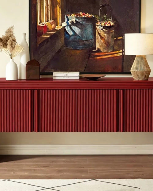 Bold red statement console featuring intricate fluted detailing, rounded edges, concealed storage, and a sculptural contemporary silhouette.