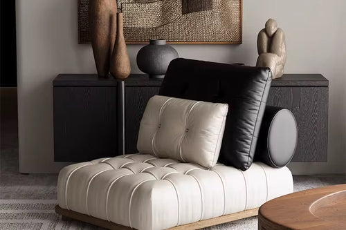 Maison Accent Chair – a luxury boho leatherette lounger with black-and-white contrast, tufted detailing, and a teak wood base. Stylish, modern, and ultra-comfortable. Luxury Accent Chair online by Chair Collective