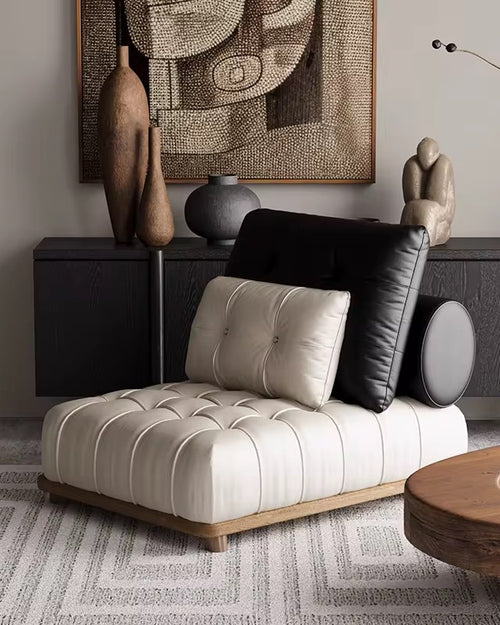 Maison Accent Chair – a luxury boho leatherette lounger with black-and-white contrast, tufted detailing, and a teak wood base. Stylish, modern, and ultra-comfortable. Luxury Accent Chair online by Chair Collective
