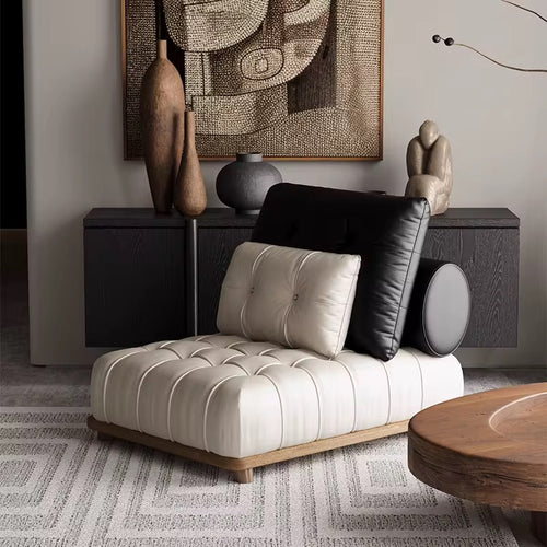 Maison Accent Chair – a luxury boho leatherette lounger with black-and-white contrast, tufted detailing, and a teak wood base. Stylish, modern, and ultra-comfortable. Luxury Accent Chair online by Chair Collective
