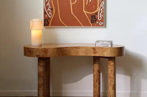 Sculptural Burno Foyer Console crafted in distinctive Mapa Burl with a natural finish, featuring an organic rounded silhouette and solid wooden legs for contemporary luxury interiors.