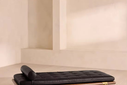 Discover the Mayan Luxury Ottoman, featuring a solid teak wood structure and matte gold accents. A premium designer ottoman for modern luxury interiors.