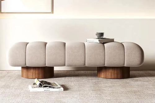 Front view of sculptural Arco Ottoman bench
