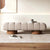 Front view of sculptural Arco Ottoman bench