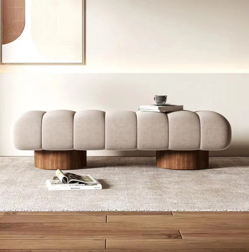 Front view of sculptural Arco Ottoman bench