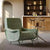 Green armchair in a modern living room 