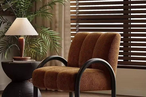 Brown lounge chair with black legs