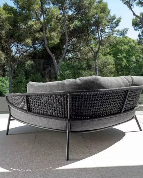 Gray outdoor sofa with wicker backrest back profile 