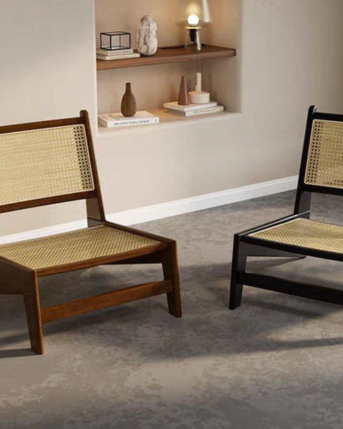 Two chairs with wicker backs and seats in a room 