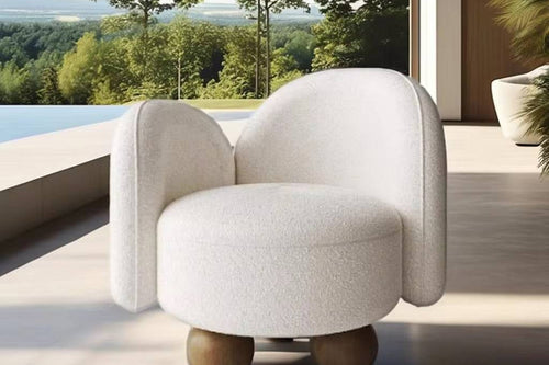 Modern white armchair with wooden legs
