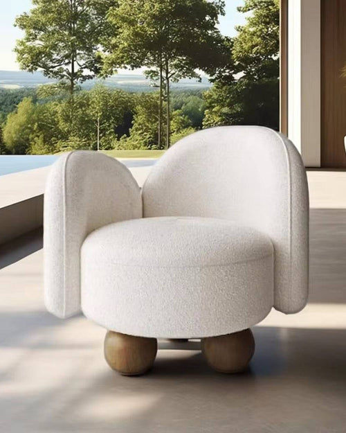 Modern white armchair with wooden legs