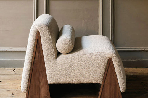 Ophelia accent chair with triangular solid wood base