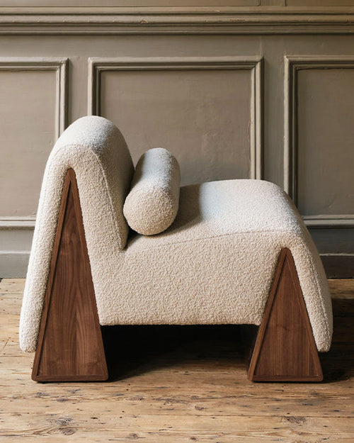 Ophelia accent chair with triangular solid wood base