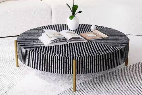 Round coffee table with black and white striped design