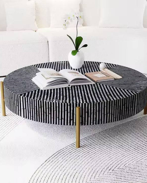 Round coffee table with black and white striped design