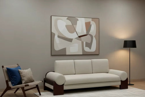 Modern statement sofa featuring a solid teak wood frame, plush upholstered seat and back cushions, and rounded arm bolsters for contemporary luxury interiors.