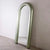 Peroni Mirror is a luxury full-length arched mirror with a sculptural frame, available in multiple colour finishes—perfect for modern bedrooms, entryways, and statement corners.