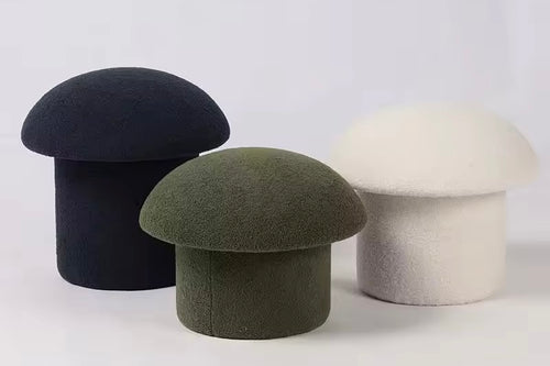 modern sculptural pouf stool upholstered in fabric for living room seating
