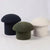 modern sculptural pouf stool upholstered in fabric for living room seating
