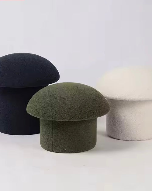 modern sculptural pouf stool upholstered in fabric for living room seating